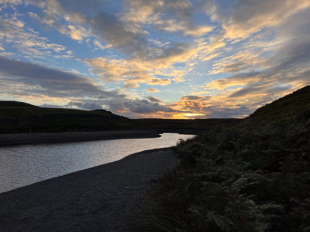 A sunset landscape over open water